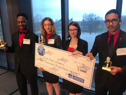 First place contest winners holding a check for $1000
