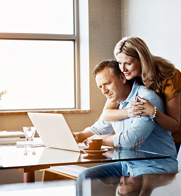 Older couple looking at a laptop computer