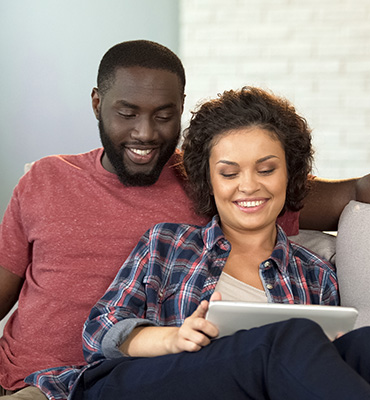 Couple looking at a smart tablet