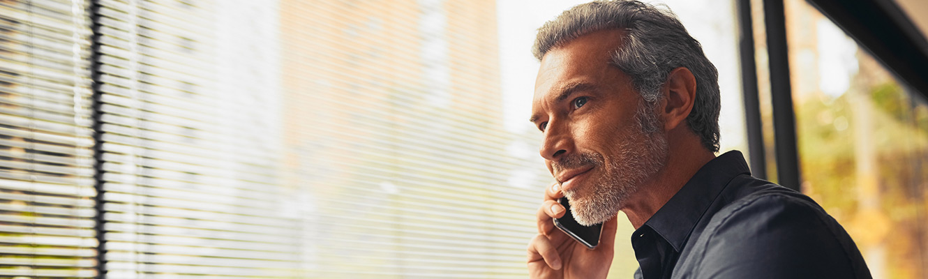 Businessman using a smartphone in office