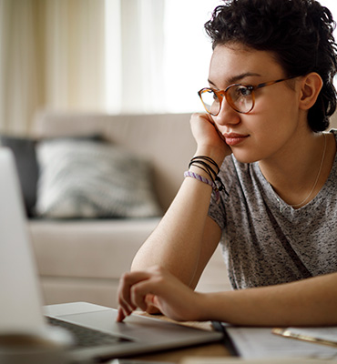 Lady looking at a laptop computer